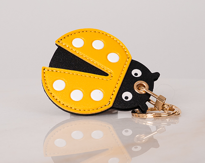 Little Explorer Universal Tracker Charm — Yellow Ladybug — product image 1