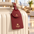 Wayfinder luggage tag — Burgundy — lifestyle on cream suitcase — all-groups