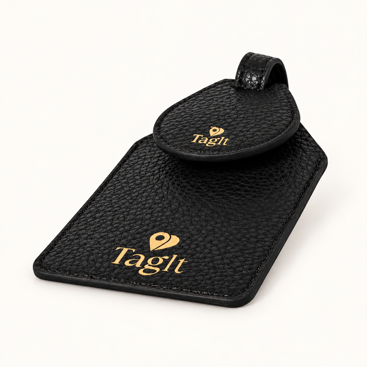 Wayfinder Pebble Leather AirTag Luggage Tag — Black on soft ivory background — all-groups
