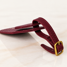 Wayfinder luggage tag — Burgundy — slim side profile and buckle strap — all-groups